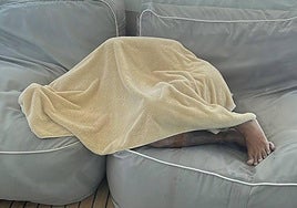 The young man, wrapped in a blanket after the rescue.