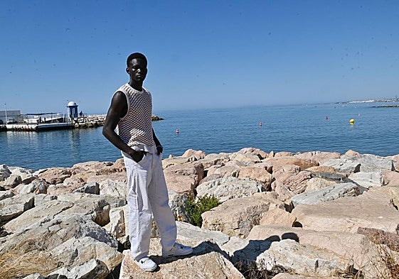Cheikh Kane works as a model and public relations officer and helps out his family in Senegal every month.