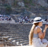 Tourists at the Roman theatre in Malaga.