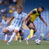 Malaga were playing their first game abroad for eight years.