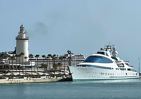 The Yas moored next to lighthouse at Malaga's megayacht marina.