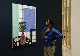 A visitor admires one of the works by Farah Atassi.