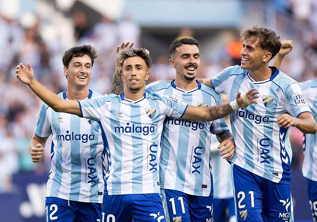 Larrubia celebrates making it 1-0 with his teammates.