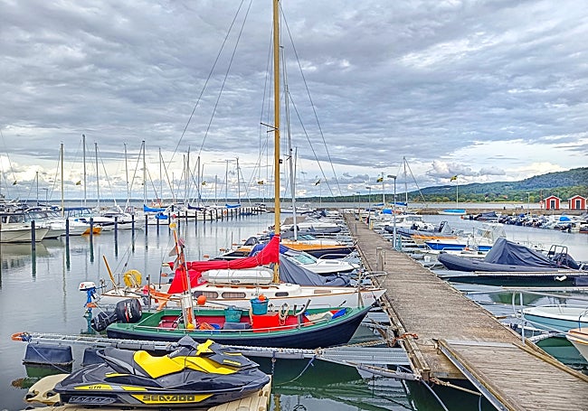Green fields and bays with boats.
