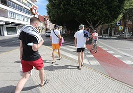 Tourists on their way to La Malagueta beach.