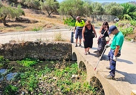 Technicians and municipal representatives inspect a stream in Monda to apply larvicide treatments as part of the plan against the Nile Virus.