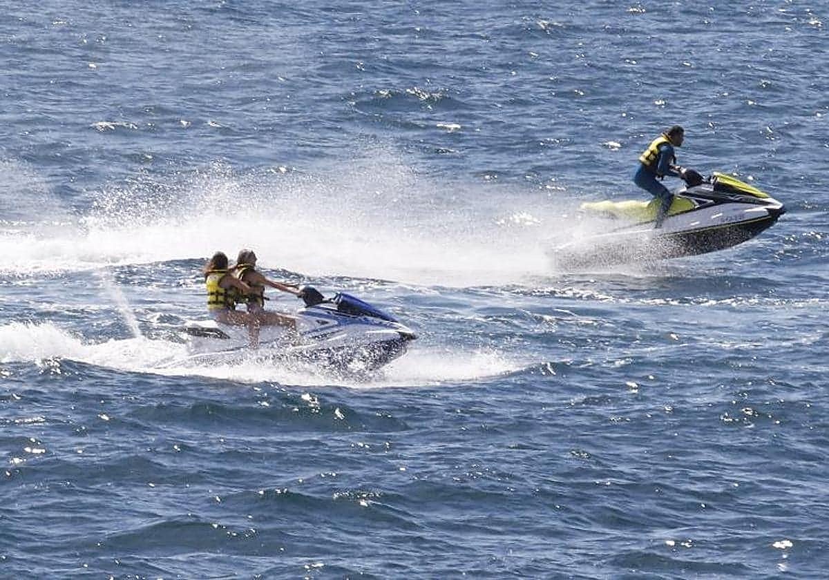 Jet skis are being monitored to ensure safety of bathers.
