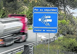 File image of warning sign for a roadside speed camera device.
