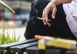 People smoking on a terrace in Spain.