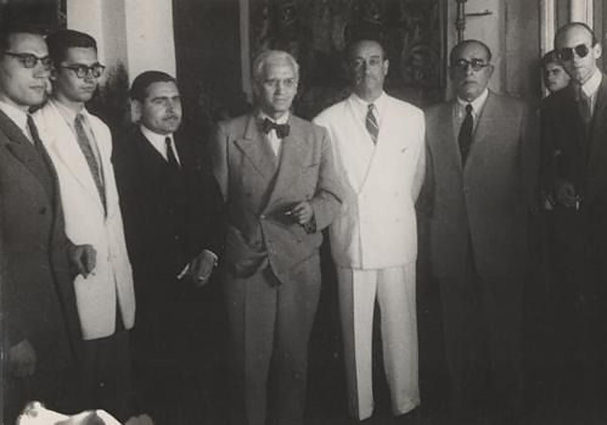 Fleming in the Cordovan hat.