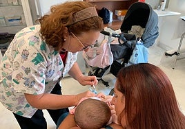 An infant being vaccinated against bronchitis.