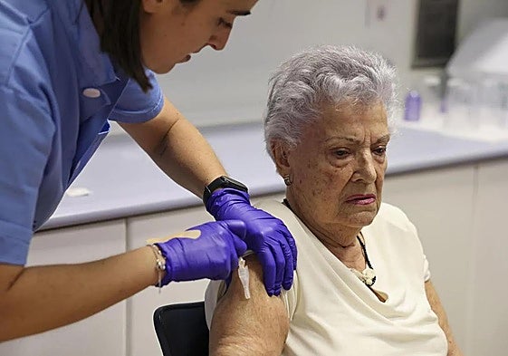 File image of a person at risk being vaccinated against influenza and Covid.