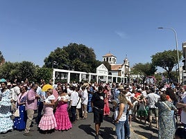 People relaxing during the street procession in the area close to Torremolinos town hall.