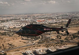 A tourist helicopter flying over Seville.