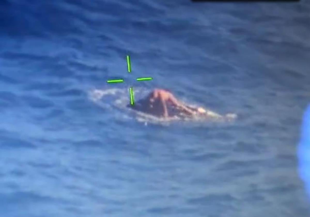 Still from the maritime rescue aircraft showing the young man stranded on the jet ski.