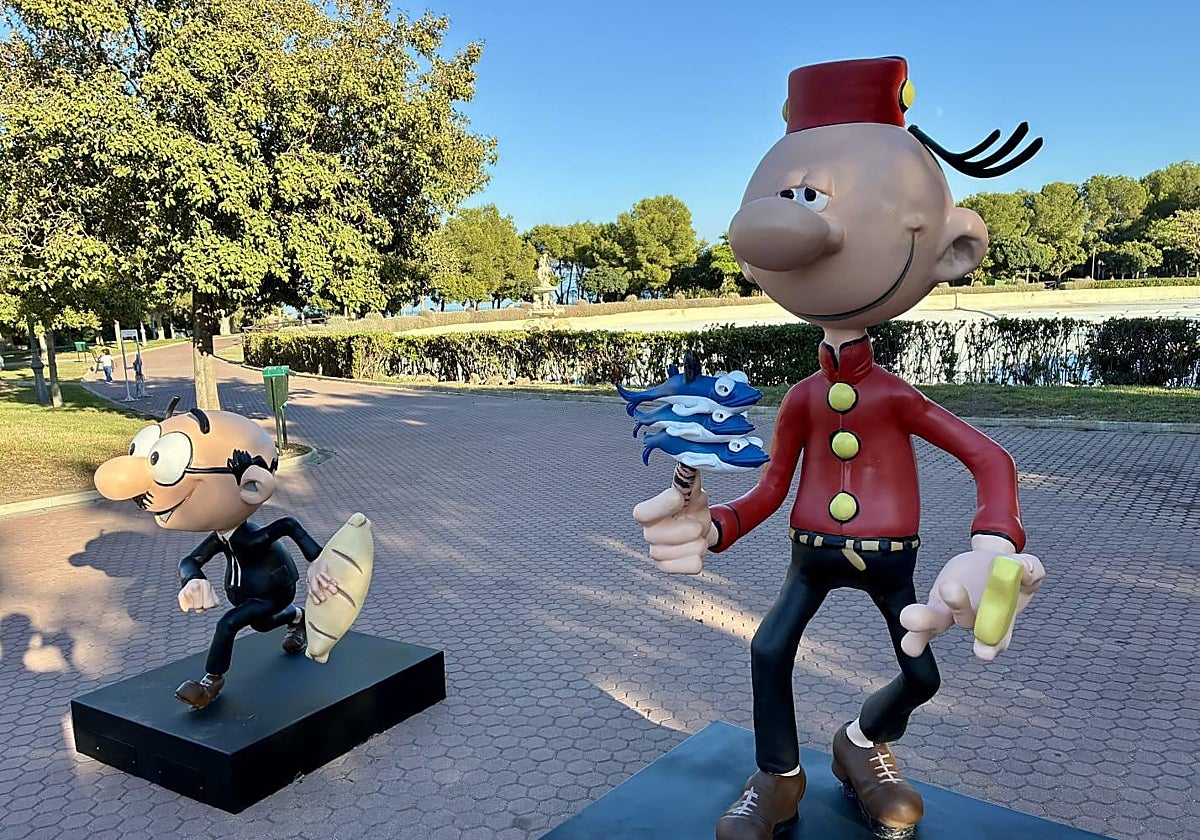 Mortadelo holding a skewer of sardines.