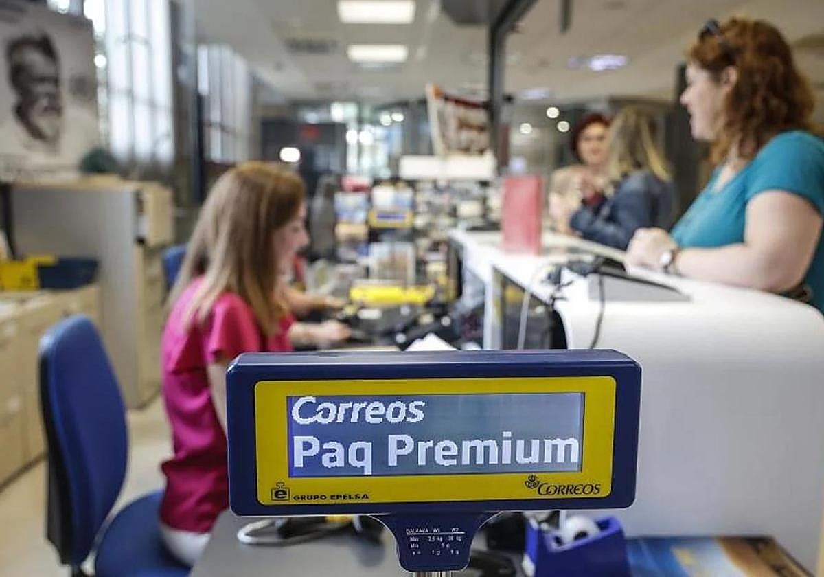 People being served at a post office in Valencia.