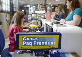 People being served at a post office in Valencia.