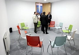 People leave a group therapy session in a mental health centre.