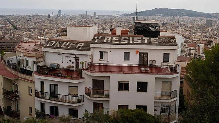 What is the first thing you should do if squatters occupy your home in Spain?
