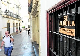 House rental sign in a window.