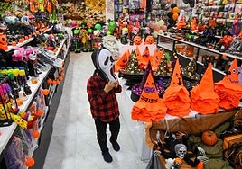 Hats and masks on sale for Halloween.