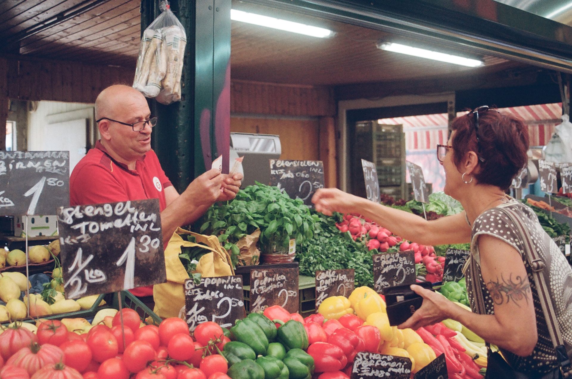 Naschmarkt. A warm exchange between vendor and buyer at the iconic market.