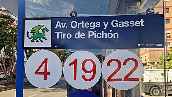 What are the cute symbols that have appeared on bus stops in Malaga?