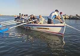 The Jabegotes de la Bahía, debuting their boat now it has been restored.