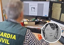 A Guardia Civil officer looks at a sketch of the missing woman from Avilés during the investigation.