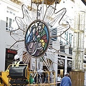 Workers hanging the first illuminated centrepieces on Calle Larios.