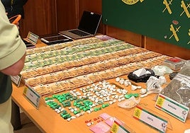 Money and drugs seized in the operation.