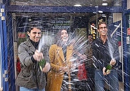 The owners of the Carrera Espinel lottery office in Ronda - Juan Barriga, María González and Miguel González - celebrate winning the El Gordo draw in 2019.