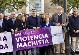 The team of the Cadiz provincial authority hold a minute of silence after the murder of a woman in Olvera.