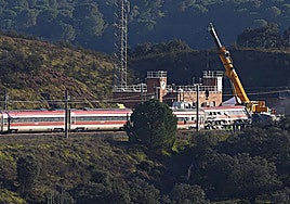 Cranes working in the area near the Adamuz station, where the Iryo train has been stranded.
