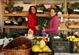 A BAM member serves a customer at the collective's shop at El Zoco in Nerja.