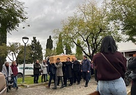 Victoria's coffin is carried on the shoulders of six bearers as it leaves the church of the municipal cemetery of Alhaurín el Grande.