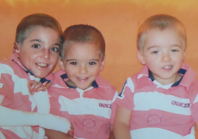 Adrián, on the left with his two, younger brothers.