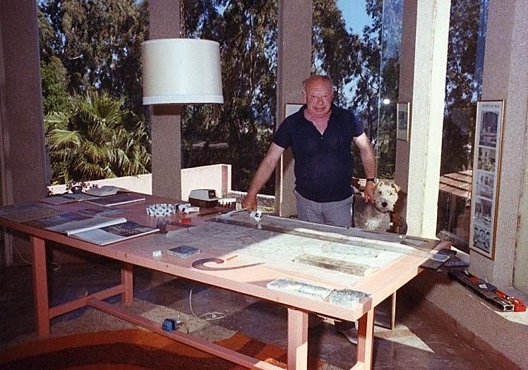 The architect, together with his dog, in the light-filled studio of his Marbella home.