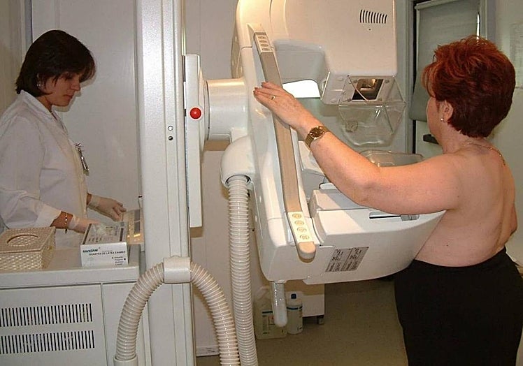A woman undergoes breast cancer screening.