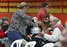 Grazalema residents being served coffee in the sports centre in Ronda.