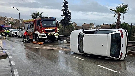 Malaga road accident: driver injured after car leaves road and overturns