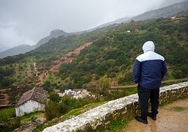 A Benaoján resident looking at the village during storm Leonardo.