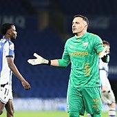 Malaga goalkeeper Alfonso Herrero complains that he was impeded.