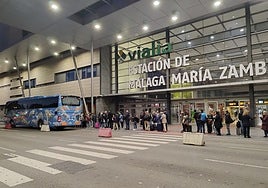 Passengers getting on the first bus that left Malaga on Wednesday.