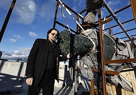 Artist Ginés Serrán standing next to one of his project.