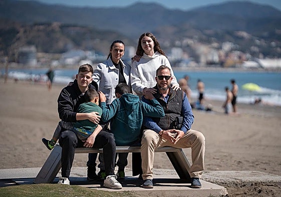 The Enamorado-Mena family, with their two older biological children and two foster children.