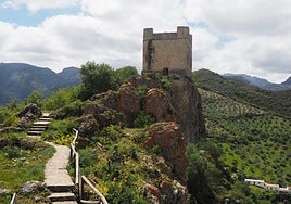 The Baroque Santa María la Mesa church rises above the village.
