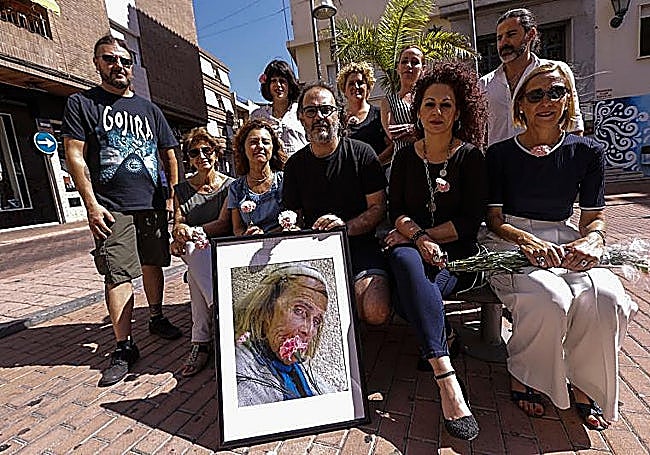 Antonio Bueno, along with friends, holding a portrait of La Juanita when they started the campaign in 2016