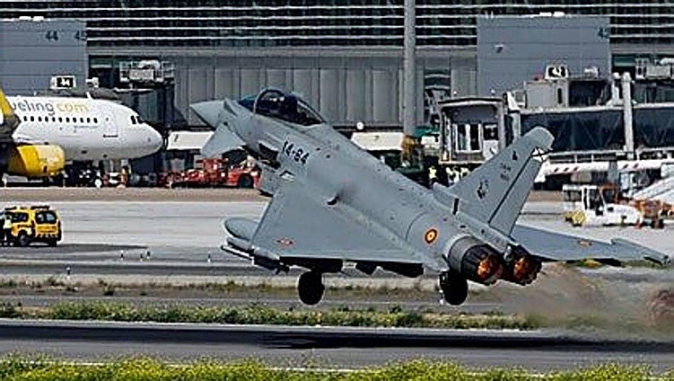 Two Eurofighters fly over Malaga's Plaza Mayor shopping centre